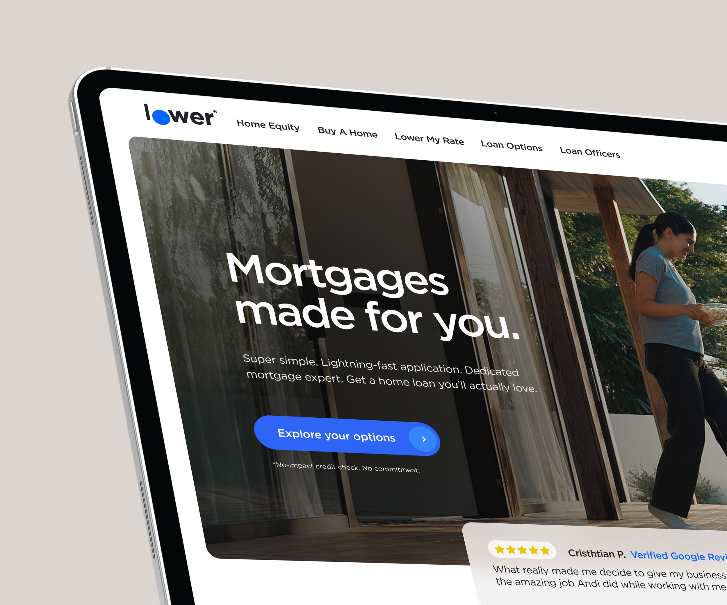 Laptop displaying a mortgage website with a woman standing on a porch.