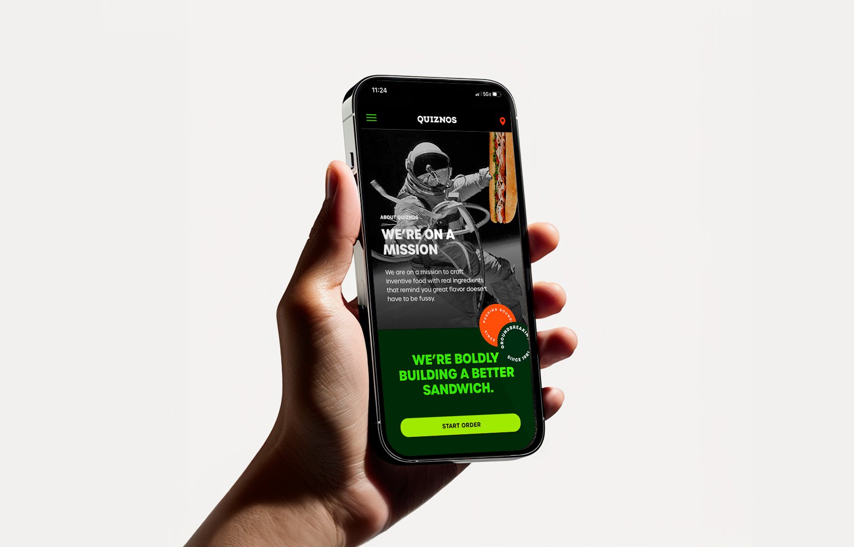 Hand holding a phone with the Quiznos about screen and a Start Order button.