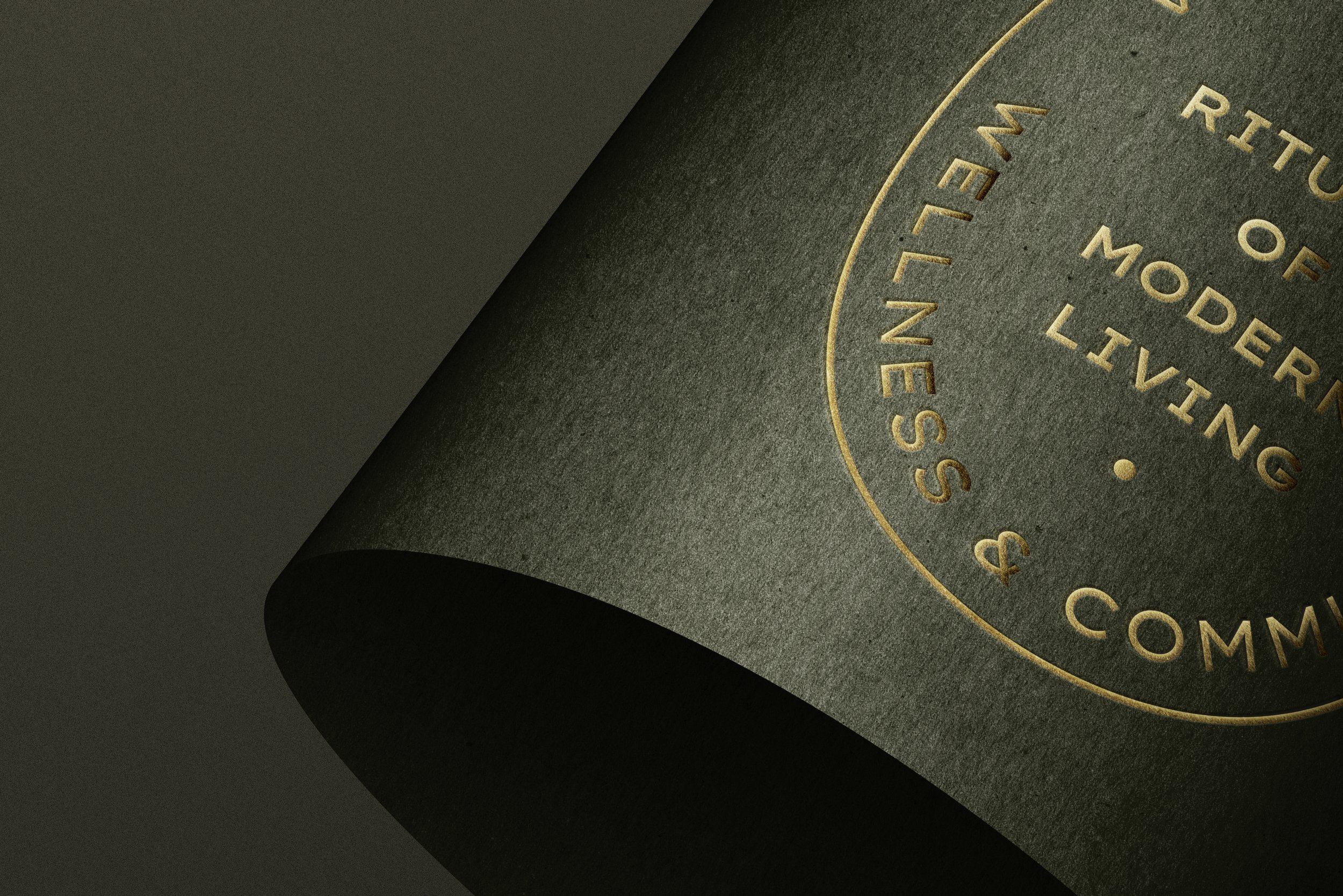 Black textured bottle with gold Vesta embossing.