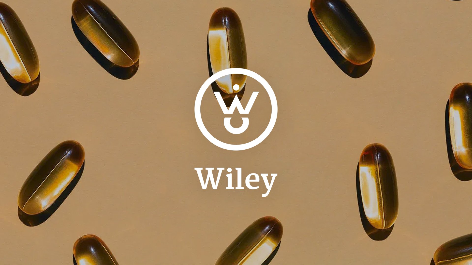 Wiley wordmark centered over brown and yellow capsules on a beige field.