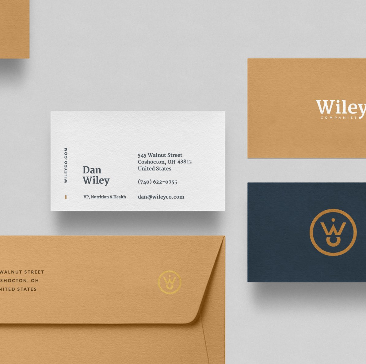 Wiley stationery in white, gold, navy, and copper.