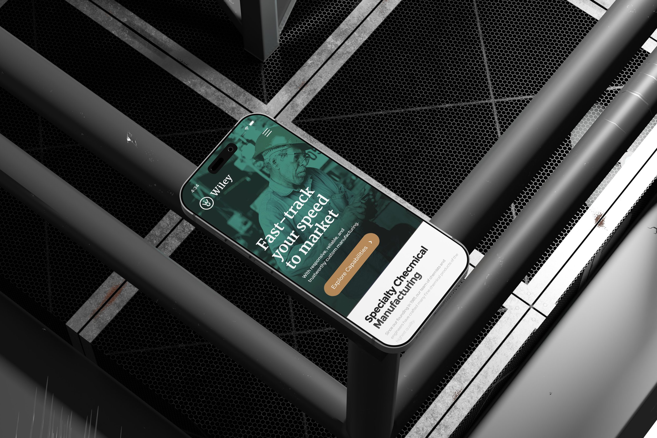Smartphone on a metal surface showing the Wiley chemical manufacturing site.